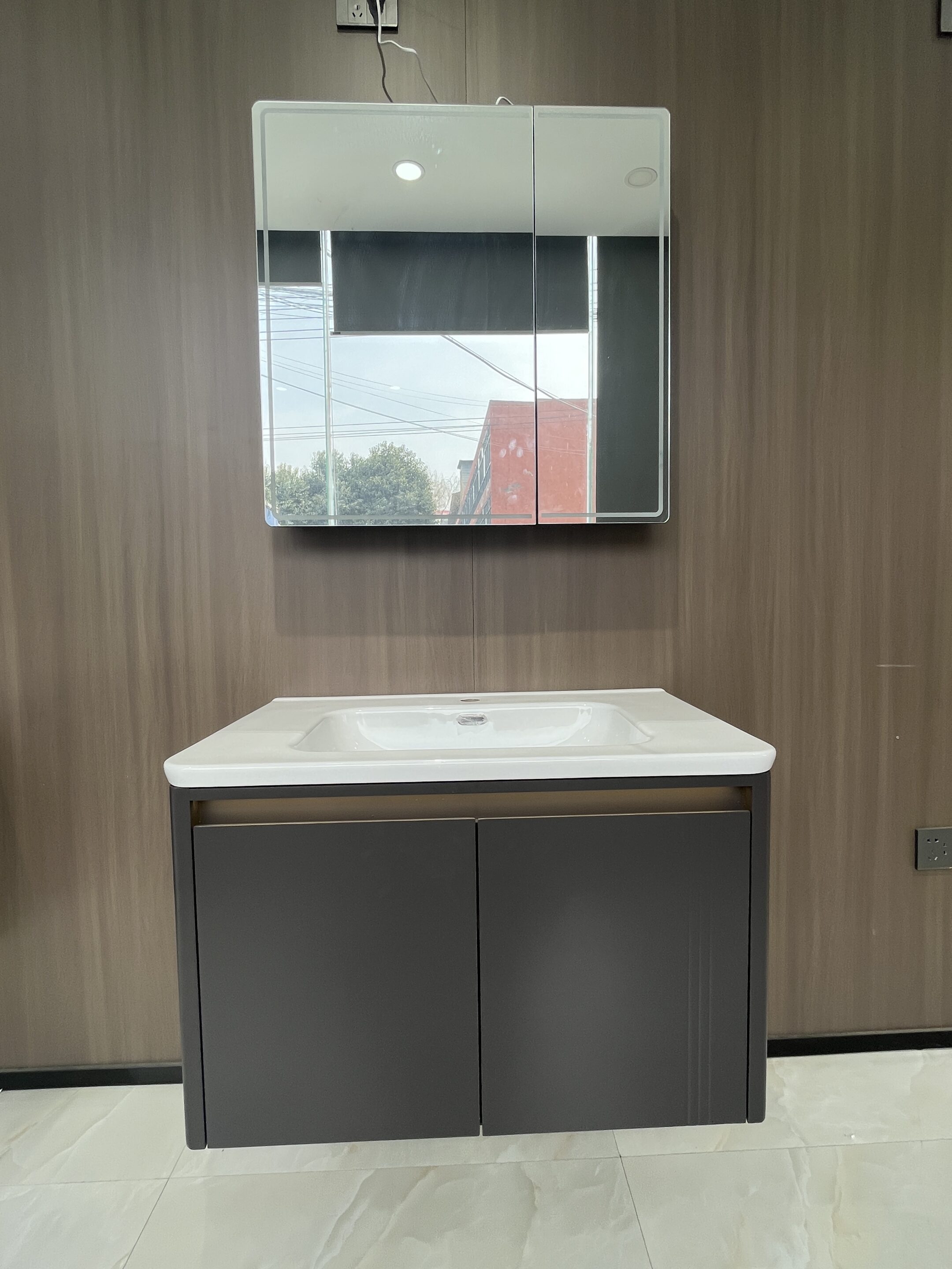 Soft-Close Doors for Commercial Bathrooms: Cycle Life Expectations 4 Bathroom vanity installation with LED mirror in a commercial bathroom