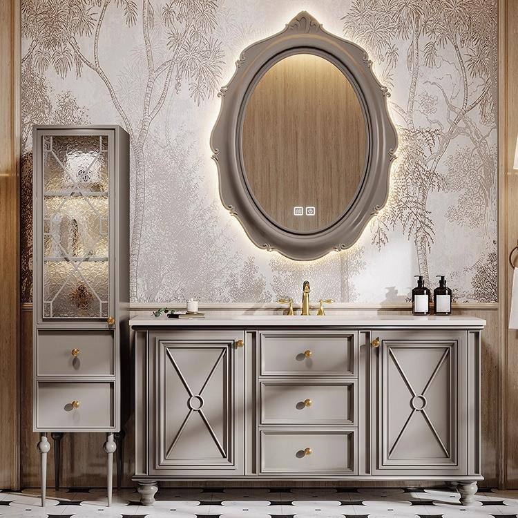 Floating white oak vanity with a soft white basin in a warm minimalist bathroom